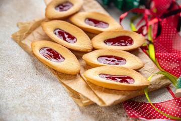 christmas cookies strawberry jam boat shape sweet cookies baked background New Year's holiday fresh meal food snack on the table copy space food background rustic top view