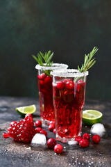Cranberry cocktail with pomegranate and rosemary.