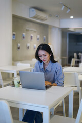 Asian woman freelancer working at coffee shop