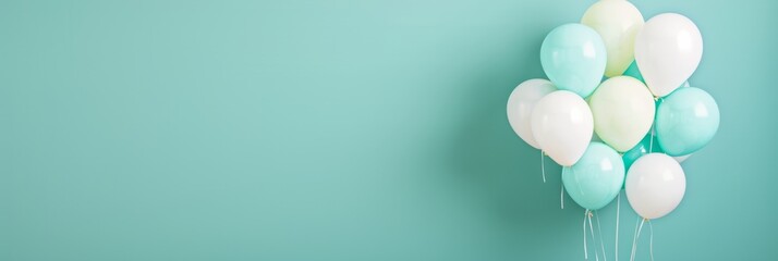 Daytime Playful Monochrome Background with Bright Teal Balloons Scattered on Pastel Teal Plain Background