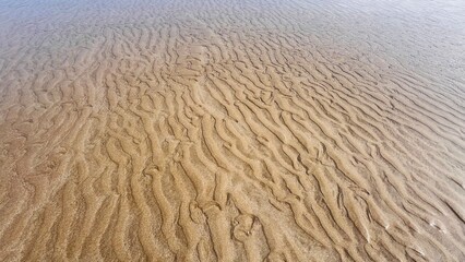 Sand wave texture background on island 