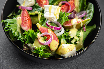 salad fig fresh green lettuce, figs, soft cheese meal food snack on the table copy space food background rustic top view vegetarian vegan food