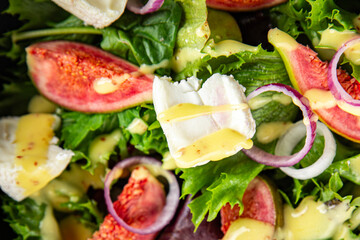 salad fig fresh green lettuce, figs, soft cheese meal food snack on the table copy space food background rustic top view vegetarian vegan food