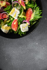 salad fig fresh green lettuce, figs, soft cheese meal food snack on the table copy space food background rustic top view vegetarian vegan food