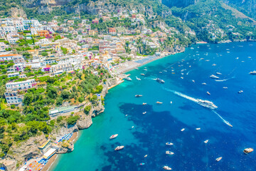 Positano town, beach and beautiful colorful houses on the cliff in Amalfi coast in Italy