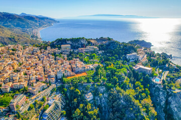 Aerial view of the Ancient theater of Taormina with Mount Etna in the background, Sicily, Italy