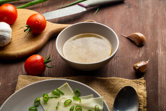 Thick meat broth, Dagestan khinkal thin dough, meat, on the table