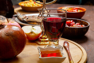Challah, honey, apple and pomegranate and wine for the Rosh Hashanah holiday