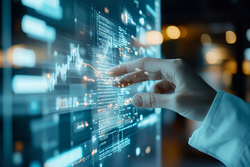 A hand is touching a computer screen with a blue background