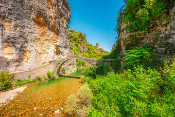 Kokkorou bridge, medieval stone bridge on river of Voidomatis, Pindus Mountains, Zagori, Greece.