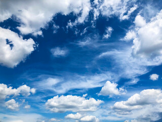 blue sky with puffy white clouds