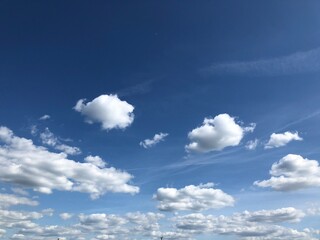blue sky with puffy white clouds