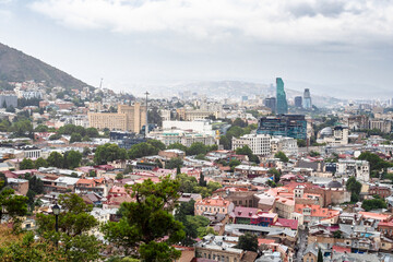 Obraz premium above view of Tbilisi city on summer cloudy day