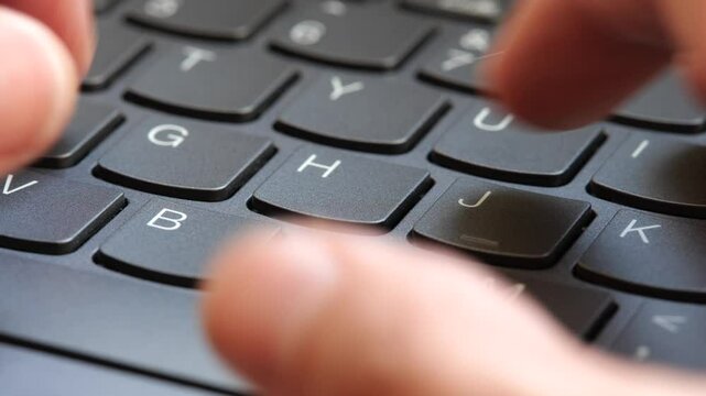 Man typing fast on a new gray modern laptop keyboard, closeup, real time, one person. Creative content writing, quickly typing something on a keyboard. Blogger, programmer simple abstract concept