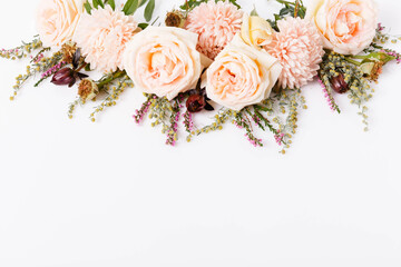 Autumn creative composition roses, asters coral flowers on white background. Fall, autumn wedding background. Flat lay, top view, copy space.