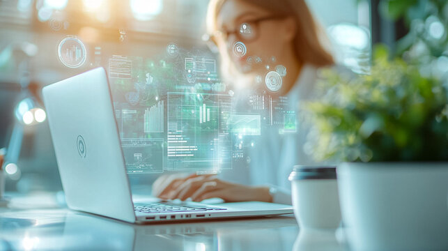 A woman is using a laptop with a green screen that has a lot of numbers - Powered by Adobe