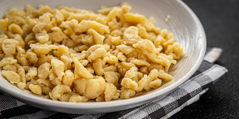 egg pasta spaetzle shape fresh meal food snack on the table copy space food background rustic top view