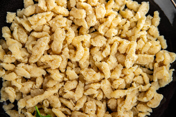 egg pasta spaetzle shape fresh meal food snack on the table copy space food background rustic top view