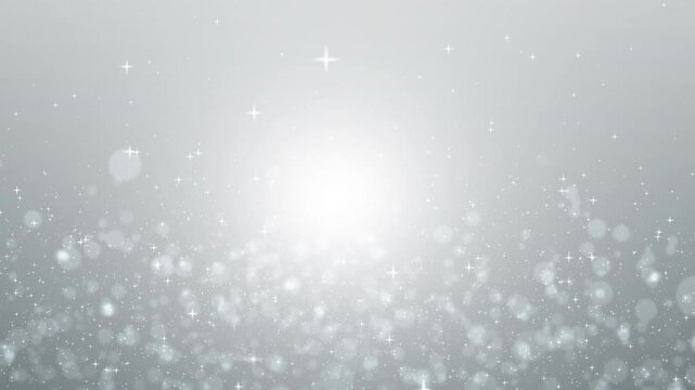 Gray background with small and large white sparkles suitable for festive designs, winter themes, elegant backgrounds, holiday decorations, and glamorous concepts.