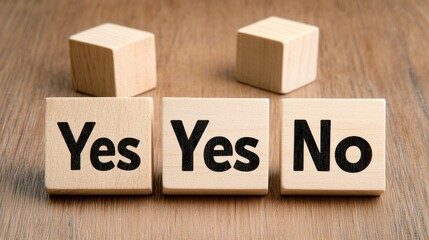 Wooden cubes with the words yes and no are arranged amidst a wooden background, reflecting choices and decisions. The top view emphasizes the natural texture of the surface