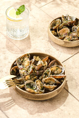 vongole with greens on a beige background