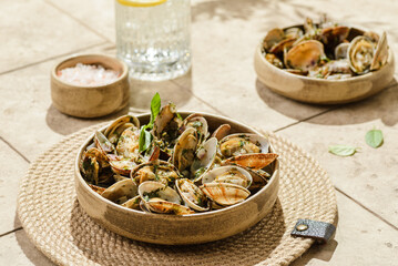 vongole with greens on a beige background