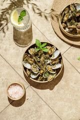 vongole with greens on a beige background