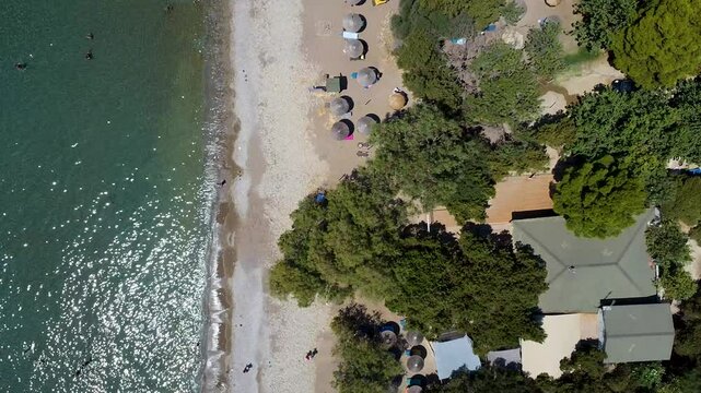 Top view aerial footage of Paralia Dafni, Zakynthos, Greece, capturing the pristine Dafni Beach, crystal-clear waters