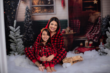 Holiday christmas camper marshmallow smores  fire mother daughter eating roasting family mother daughter 