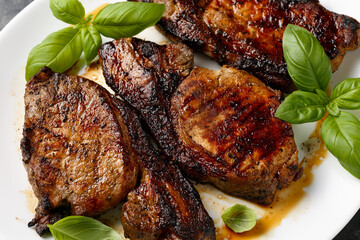 Grilled Pork Loin steaks in a white plate