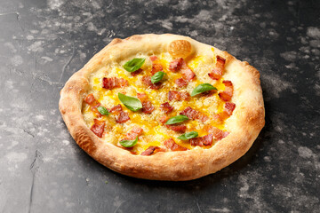 Italian Pizza carbonara with egg yolk, cream, pancetta, parmesan and Mozzarella cheese