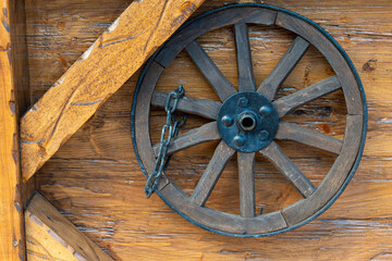 wooden wheel with a chain on it