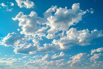 Expansive Blue Sky with Fluffy White Clouds