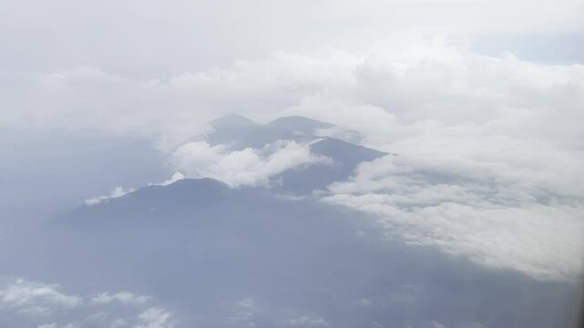 View from an airplane window flying over the mountains in Costa Rica en route to San Jose International Airport.