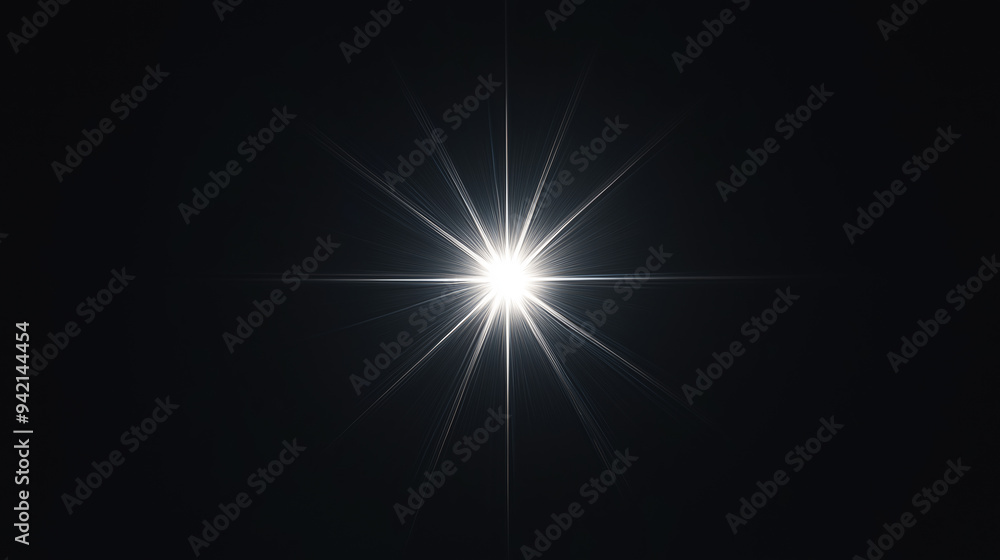 Wall mural bright light burst resembling a star on a black background. the image emphasizes the radiating light