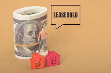 a miniature figure standing on a roll of money, with a speech bubble labeled 