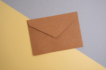 Paper envelopes on a light background. New mail, write a message. Send and receive mail. Postal delivery service. Empty envelope, empty space. Communication with people, paperwork. Envelope close-up