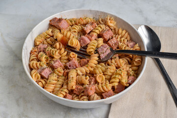 fusilli  pasta with  diced spam  and seasoning