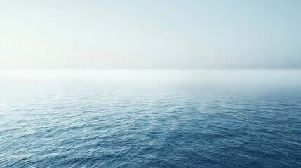 Obraz premium A blue sky with white clouds above a large body of water in the center