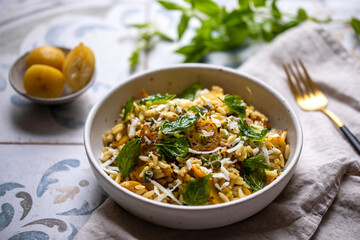 Orzo pasta with yellow courgette, preserved lemon and basil