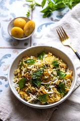 Orzo pasta with yellow courgette, preserved lemon and basil