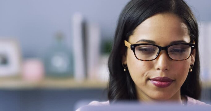 Woman, glasses and laptop on sofa for reading, planning and online education, e learning or happy results. Young person or student with vision on computer for school research or college registration