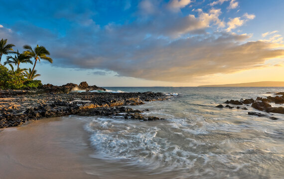 Evening light in small cove known as Secret Beach near Makena, Maui, Hawaii.