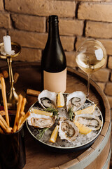 Elegant oysters on ice with lemon and white wine, perfect for gourmet dining and special occasions