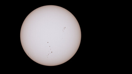 photograph of the sun made with a reflex camera, sunspots are observed