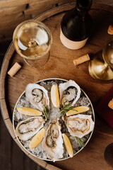 Elegant oysters on ice with lemon and white wine, perfect for gourmet dining and special occasions