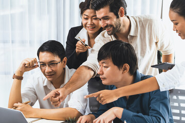 Fototapeta premium Group of diverse office worker employee working together on strategic business marketing planning in corporate office room. Positive teamwork in business workplace concept. Prudent