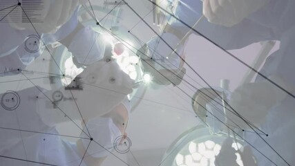 Performing operation, surgeons with medical data processing animation over surgical scene - Powered by Adobe