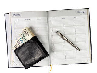 Wallet with money, pen and calendar.