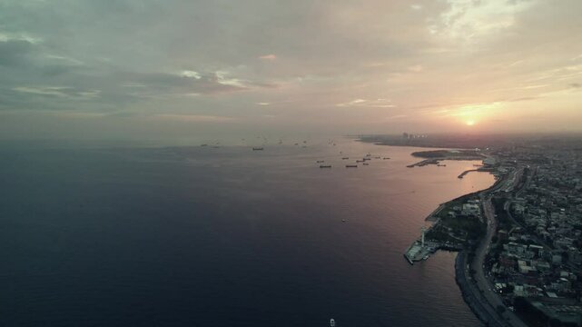 Panoramic aerial view of sea of Marmara, Istanbul lighthouse tower and sea landscape with sea landscape with ships and vessels in atmospheric sunset